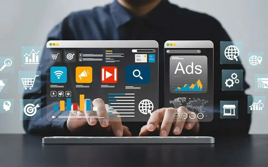 Futuristic digital overlay showing web browser analytics, graphs, and ads, with a user typing on a keyboard.